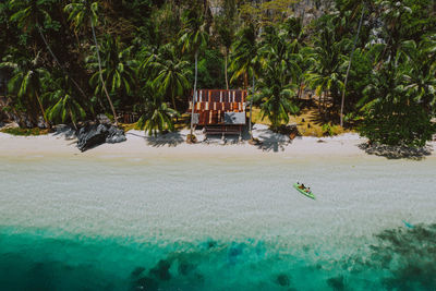 Drone view of couple at beach on sunny day