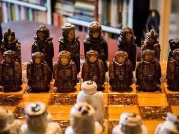 High angle view of figurines on chess board