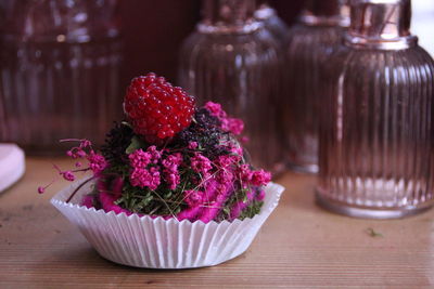 Close-up of pink roses on table