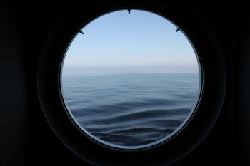 Scenic view of sea seen through window