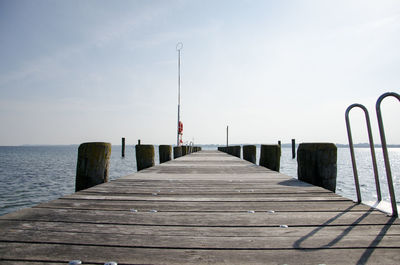 Pier over sea against sky