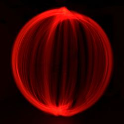 Close-up of light painting against black background