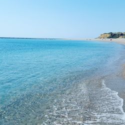 View of calm blue sea against clear sky