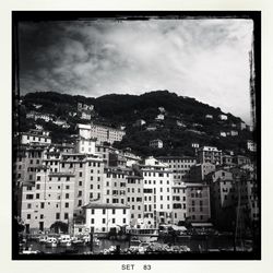 Buildings against cloudy sky