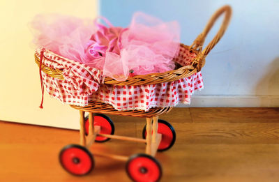 Close-up of pink flower in basket on table