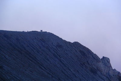 Low angle view of rock formations against sky