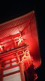 Low angle view of illuminated built structure at night