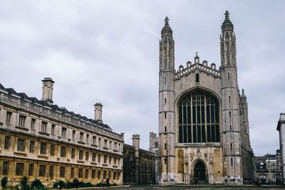 Low angle view of buildings in city against sky