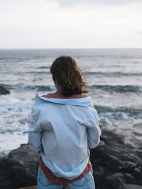 Rear view of woman looking at sea