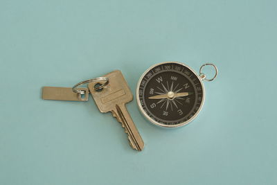 Directly above shot of wristwatch against blue background