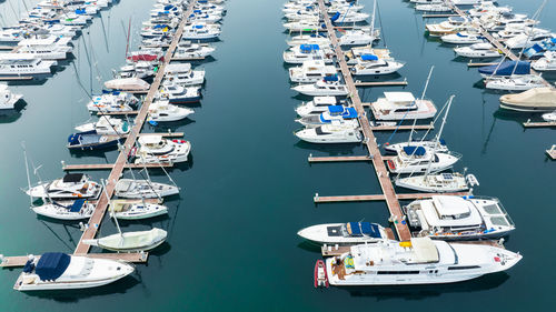 Boats moored at harbor