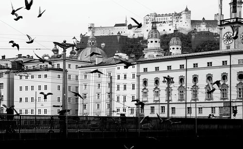 Low angle view of buildings in city against clear sky