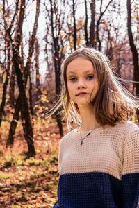 Portrait of young woman in forest