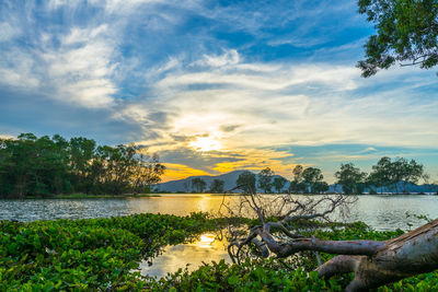 Scenic view of lake against sky during sunset