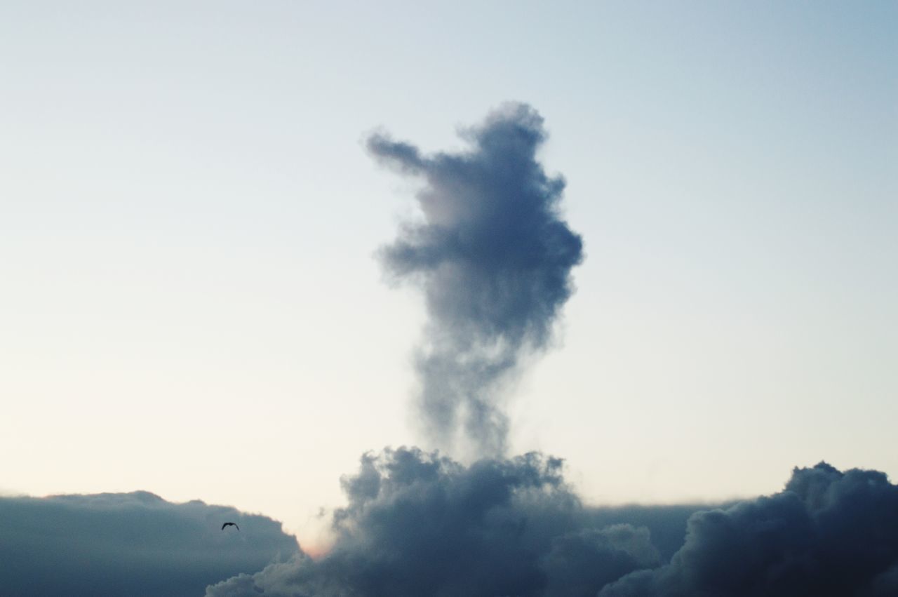 LOW ANGLE VIEW OF SMOKE EMITTING FROM SKY