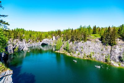 Scenic view of lake against clear blue sky