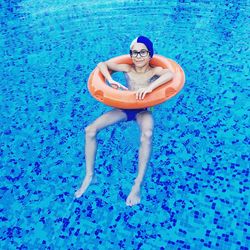 Portrait of a man swimming in pool