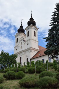 Low angle view of bell tower against sky