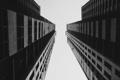 Black and white photo of two identical towers located in the heart of manila, philippines. 