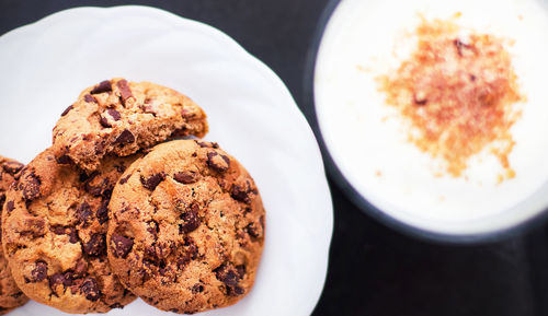 Close-up of chocolate chip cookies in plate on table