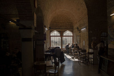 People in corridor of building