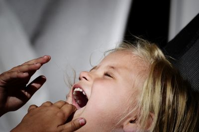 Close-up of girl with mouth open