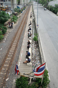 High angle view of people on railroad track