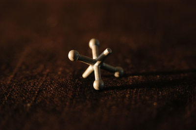 High angle view of cross on table