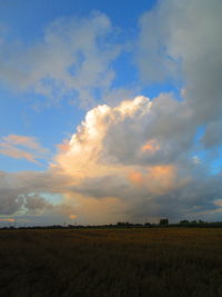 Scenic view of field against sky during sunset