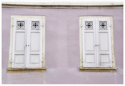 Low angle view of closed windows of house