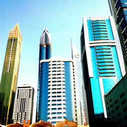 Low angle view of skyscrapers against sky