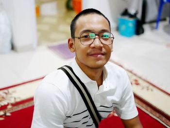 High angle portrait of smiling man at home