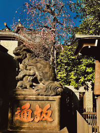 Low angle view of statue against building