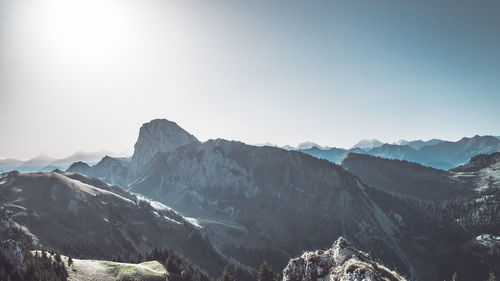 Scenic view of snowcapped mountains against clear sky