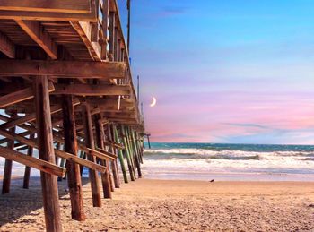 Scenic view of beach against sky during sunset