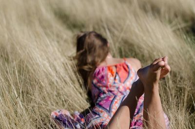Rear view of women on field