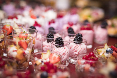 Close-up of desserts in glasses on table