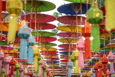 Low angle view of decorations hanging at market stall