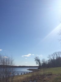 Scenic view of landscape against blue sky