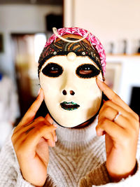 Close-up portrait of woman wearing mask