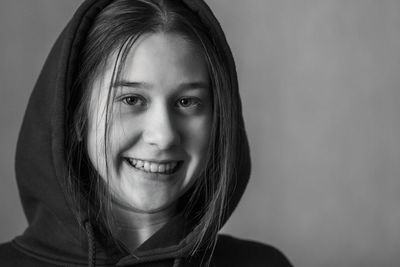 Close-up portrait of a smiling young woman