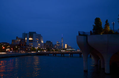 Illuminated buildings at waterfront