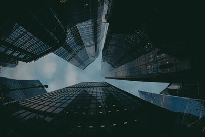 Low angle view of modern buildings in city against sky