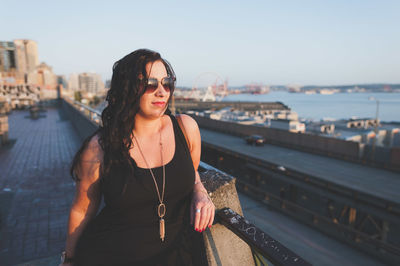 Rear view of woman standing in river