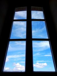 Low angle view of sky seen through window