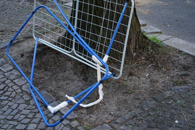 High angle view of brocken clothes horse on street