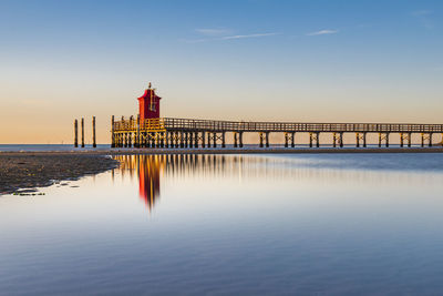 View of lighthouse in sea against sky