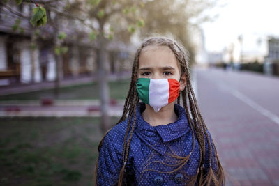 Portrait of girl standing on street