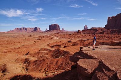 Side view of girl standing on cliff at oljato-monument valley