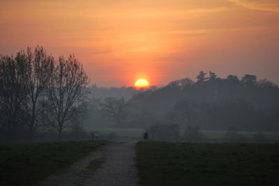 Scenic view of landscape against sky during sunset